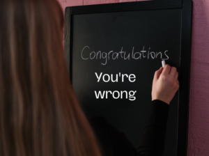 Woman writing on a black board