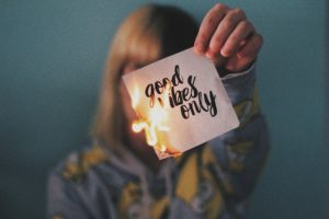 A girl burning a paper