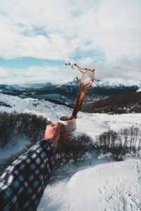 Guy throwing his coffee in the snow