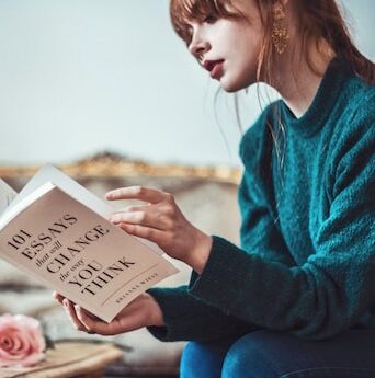 A woman reading a book on change