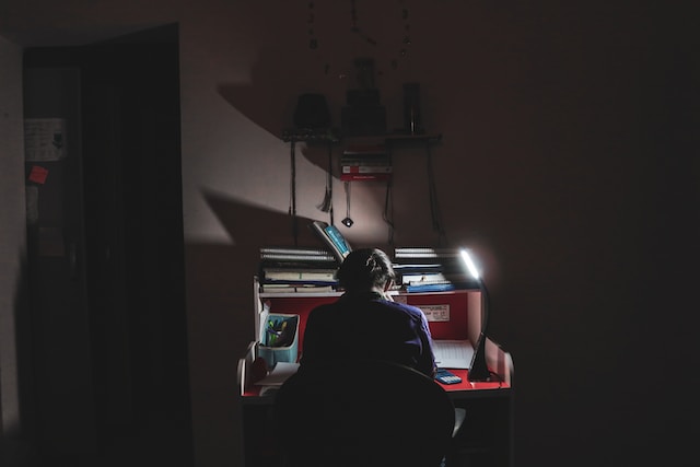 A person working in a dark room
